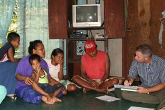 Air Force photo - Mark Duffy interviews family on Yap Island investigaing Zika outbreak