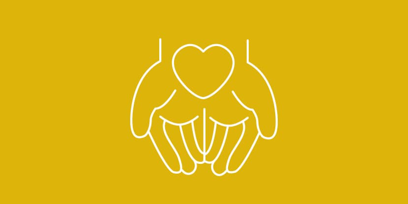 A graphic of a heart being held by two hands.